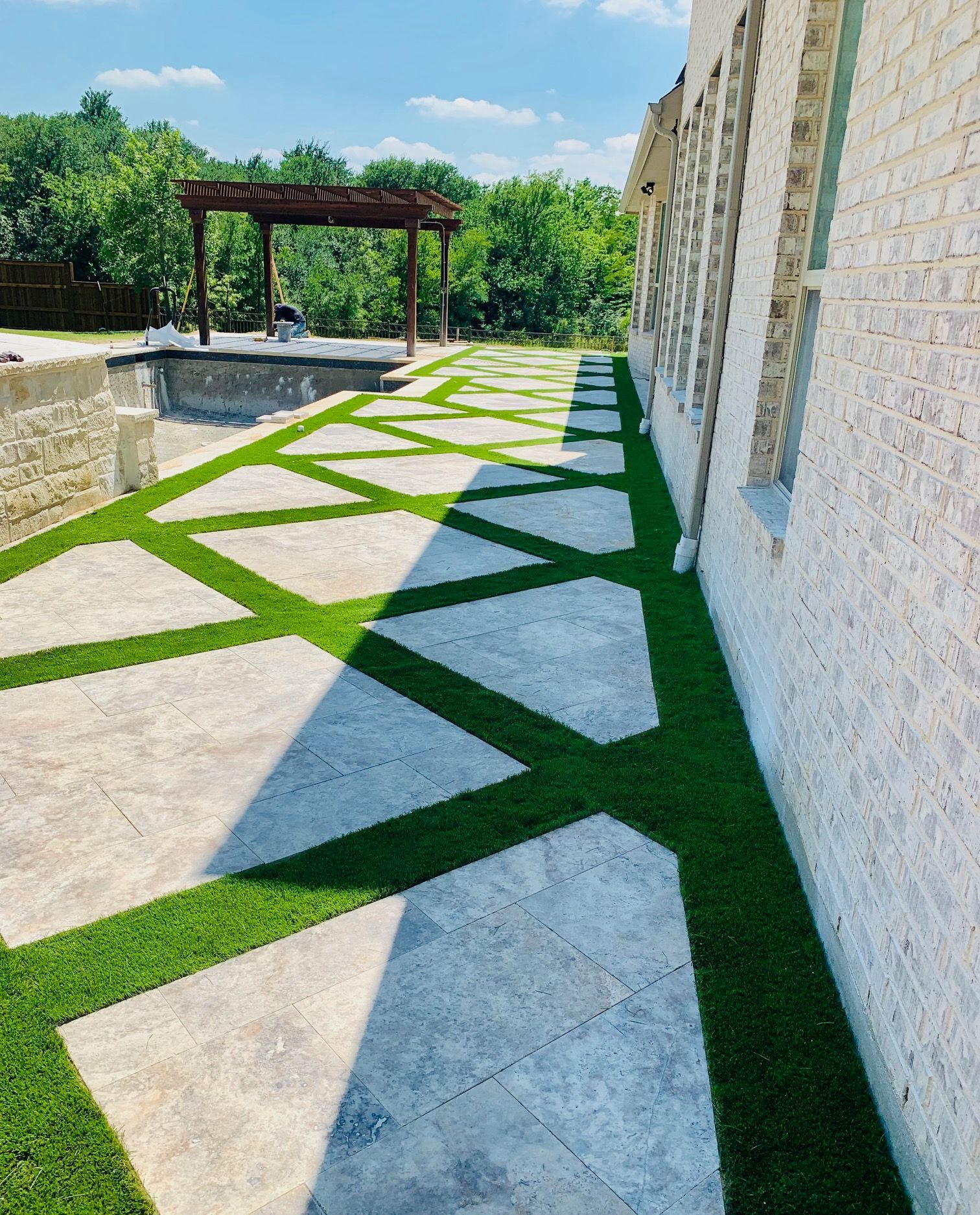 A brick building with a lawn in front of it