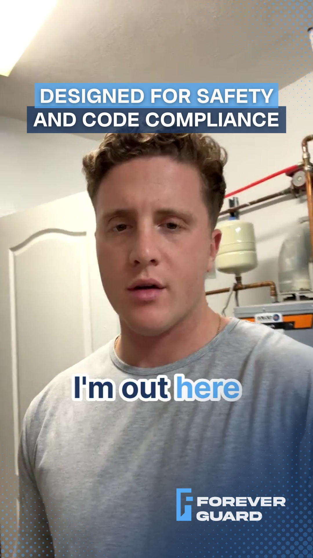 Man in a grey shirt in a utility room. Text overlay: 