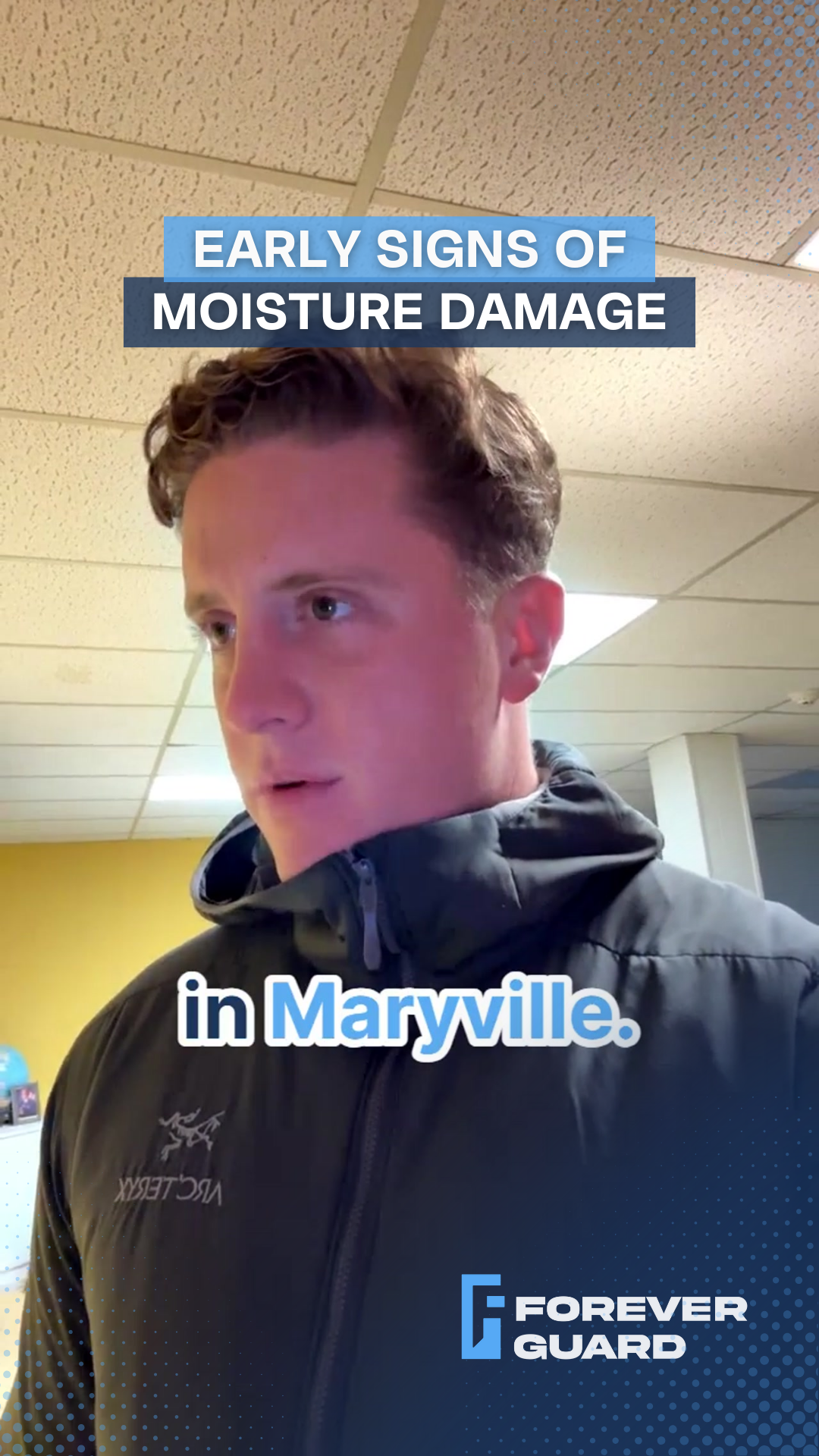 Man in jacket talking about moisture damage in Maryville, with text overlay.