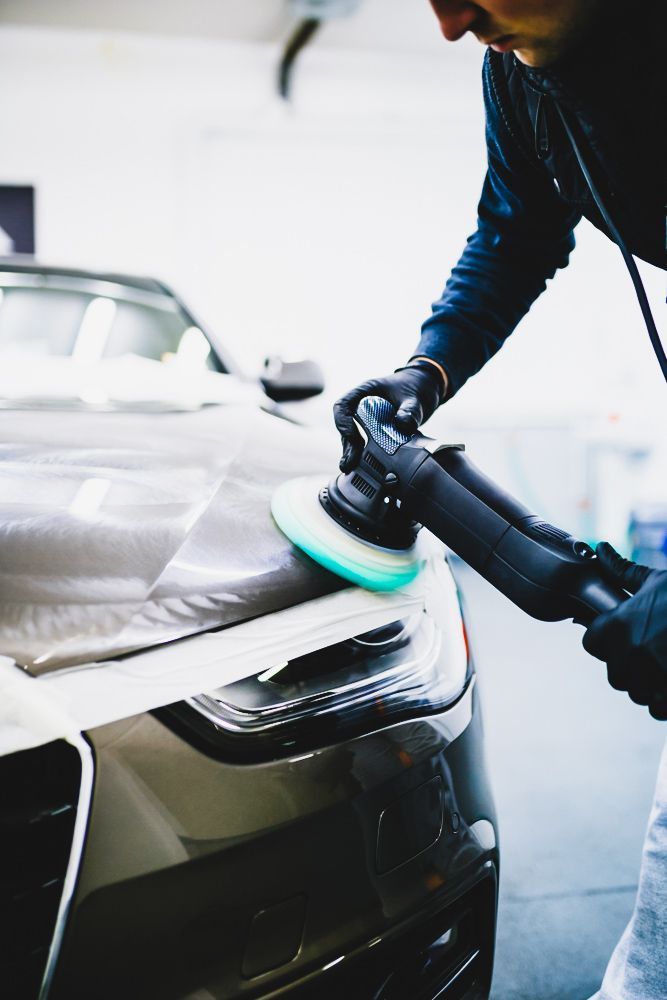 Worker Polishing Car Hood — Old School Custom And Collision in Fawkner, VIC