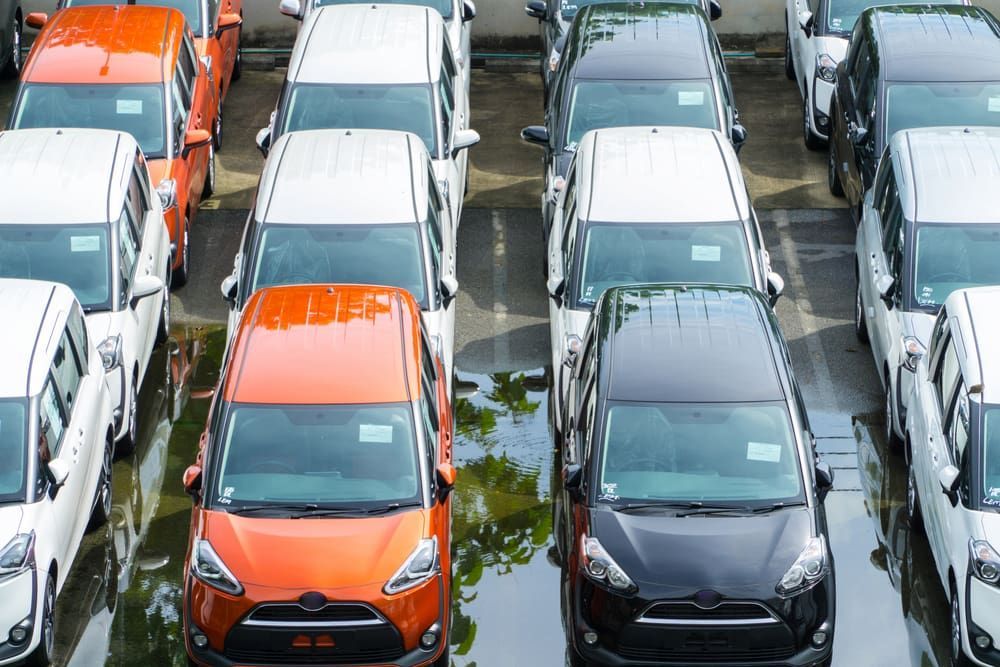 A Row Of Cars Are Parked In A Flooded Parking Lot — Old School Custom And Collision in Fawkner, VIC