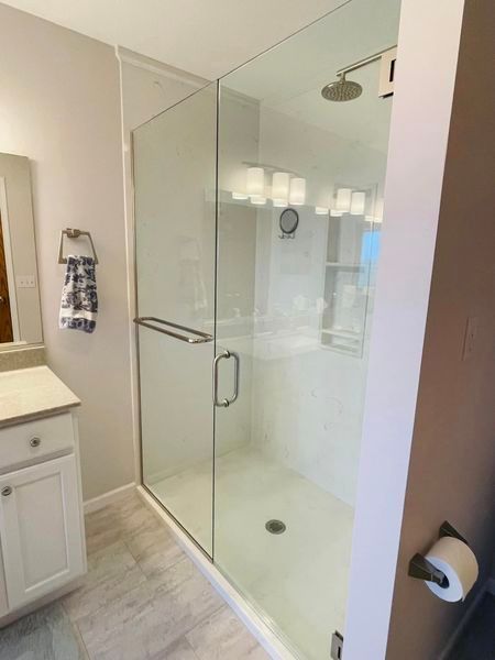 Bathroom With A Walk In Shower And A Sink — St. Joseph, IL — Campbell Construction