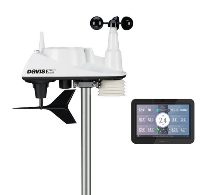 A weather station with a wind vane and a touchscreen.