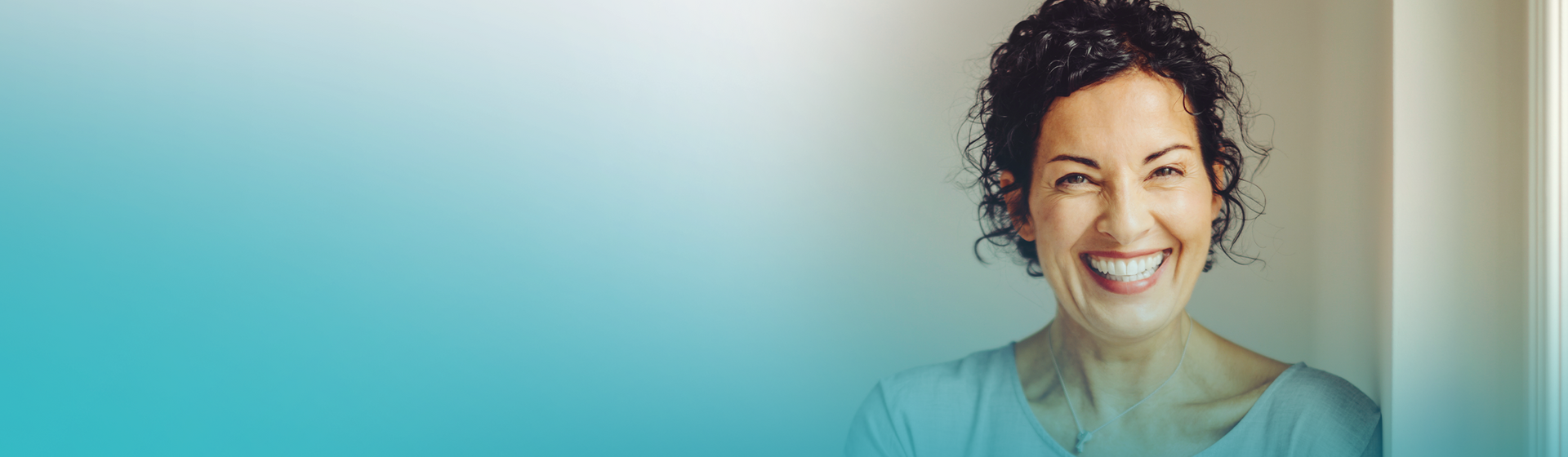 Confident middle-aged woman smiling after aesthetic dental treatment at MALO CLINIC