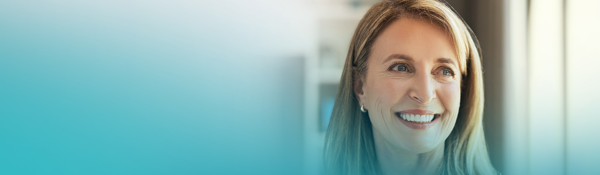 Woman smiling at the dentist with fixed teeth.