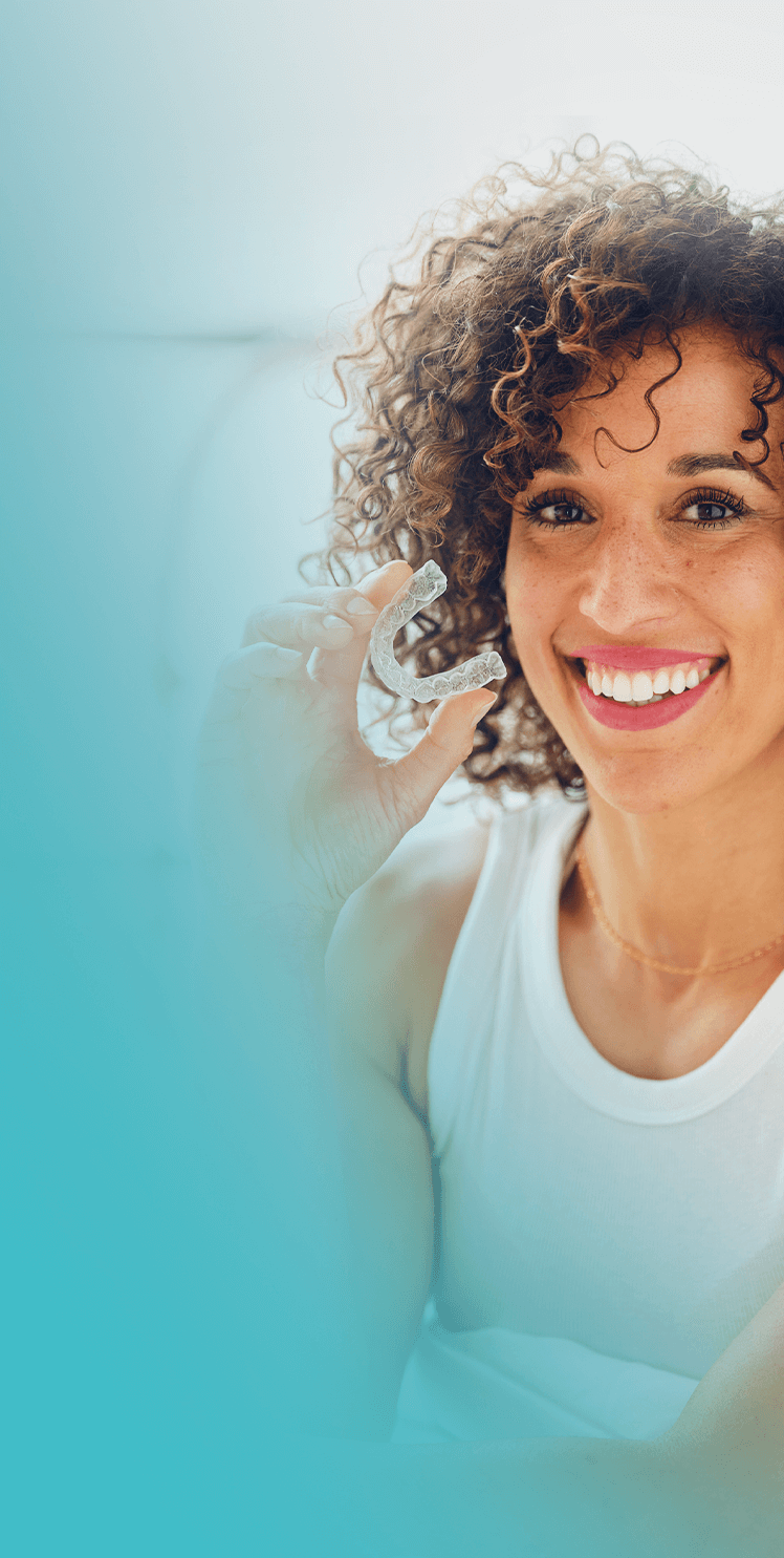 Confident woman smiling after aesthetic dental treatment at MALO CLINIC