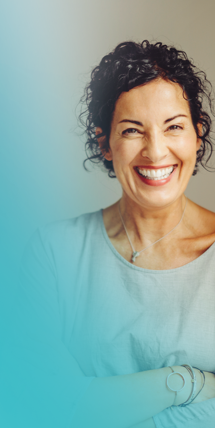 Confident middle-aged woman smiling after aesthetic dental treatment at MALO CLINIC

