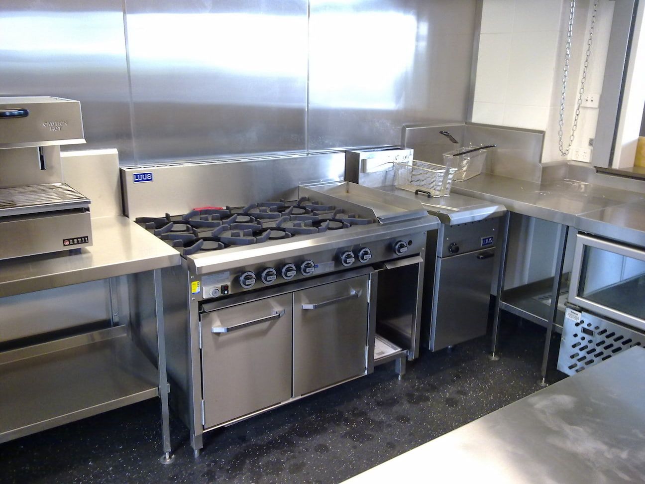 A Gas Stove In A Commercial Kitchen — Grant Wannan Plumbing in Wollongbar, NSW