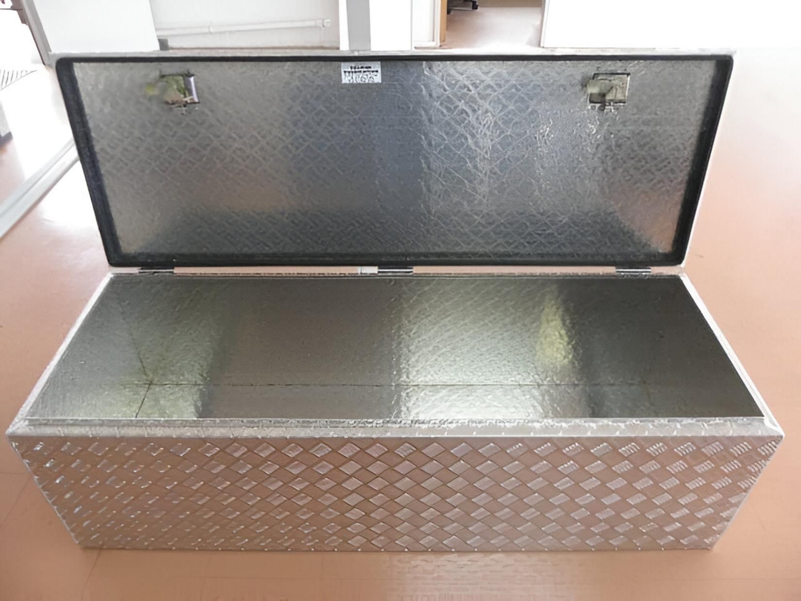 A Metal Box With the Lid Open is Sitting on a Brown Floor — Eclipse Fabrication in Atherton, QLD