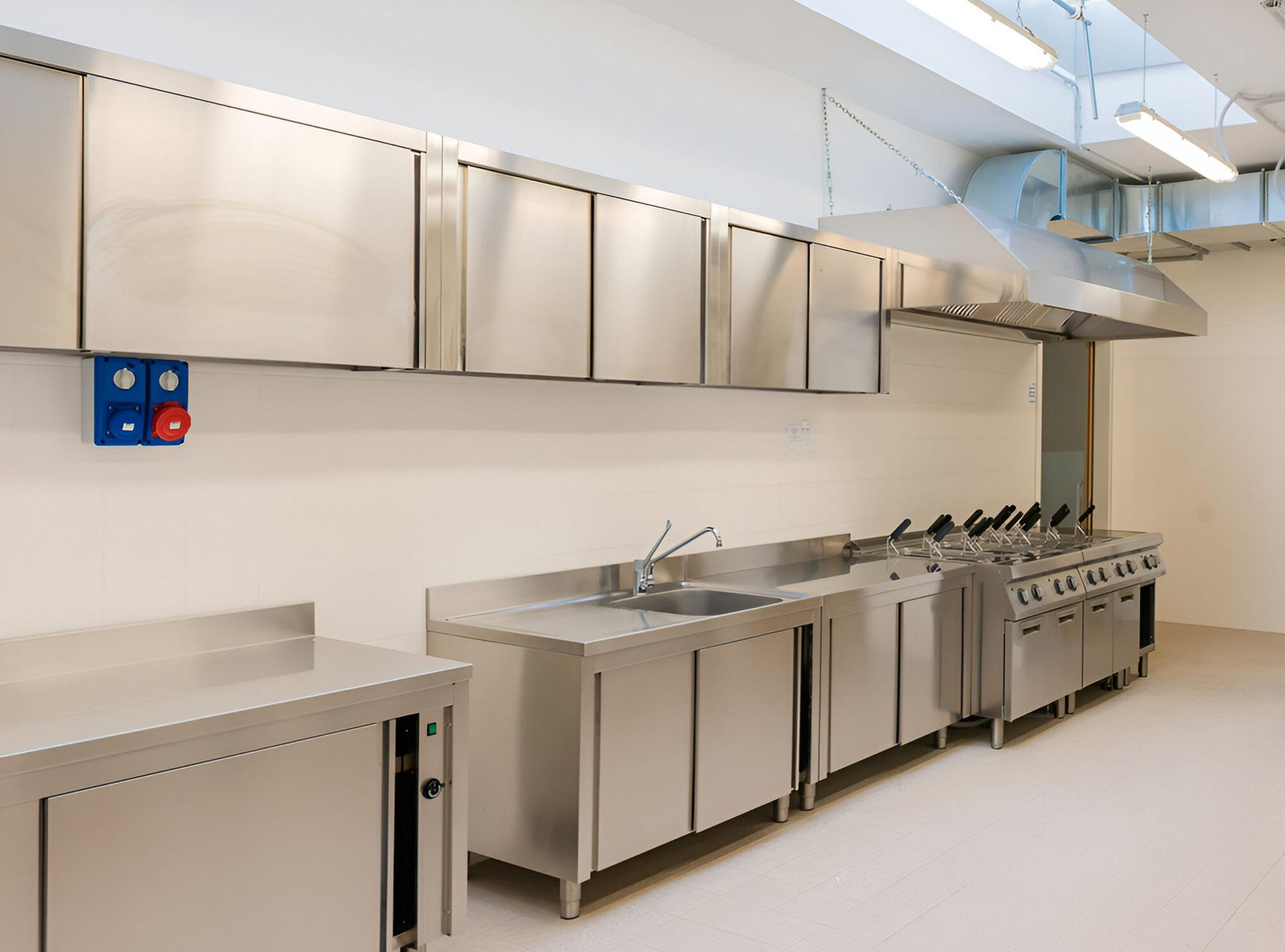 A Kitchen With a Lot of Stainless Steel Appliances and Cabinets — Eclipse Fabrication in Atherton, QLD