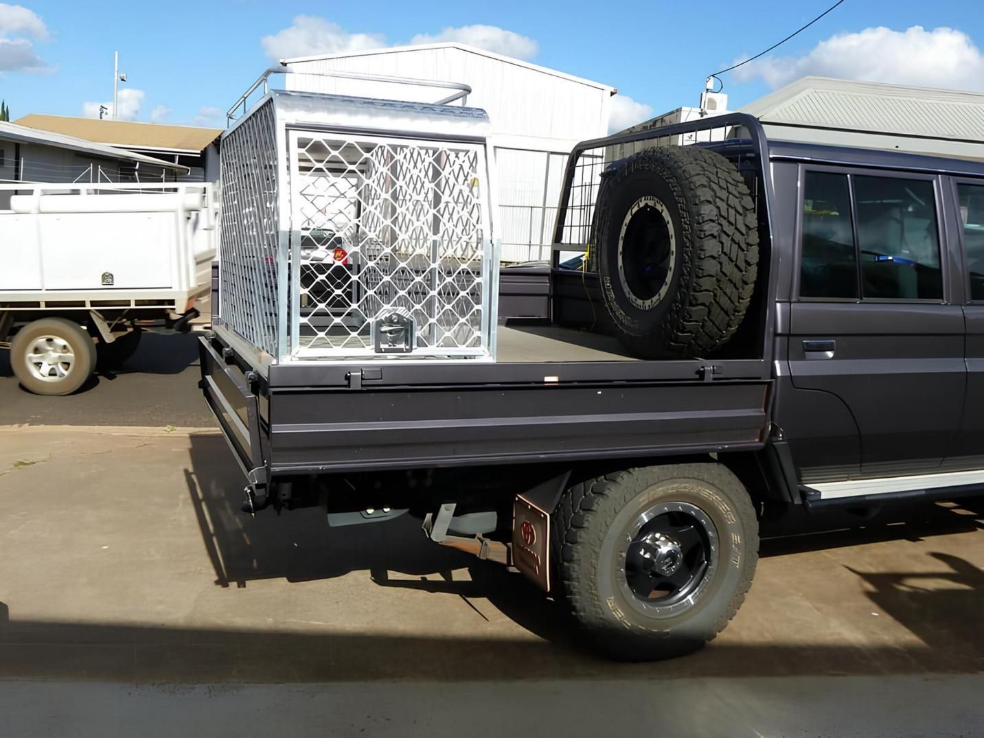 A Truck With a Tire on the Back of It — Eclipse Fabrication in Atherton, QLD