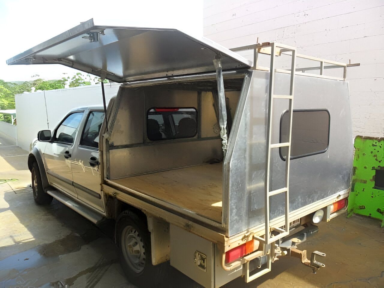 A Truck With a Canopy and Ladder on the Back is Parked in a Parking Lot — Eclipse Fabrication in Atherton, QLD