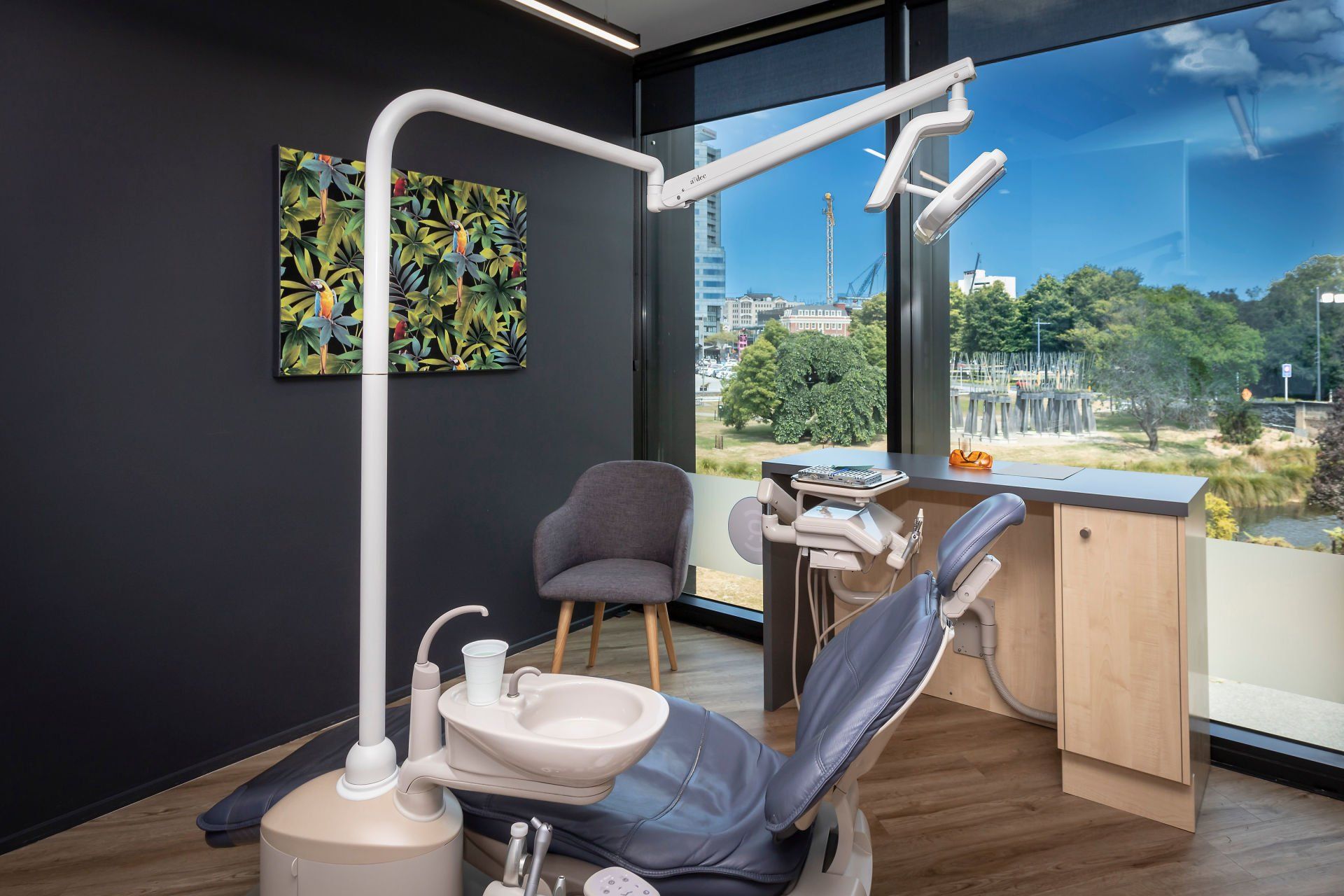A dental office with a dental chair and a sink