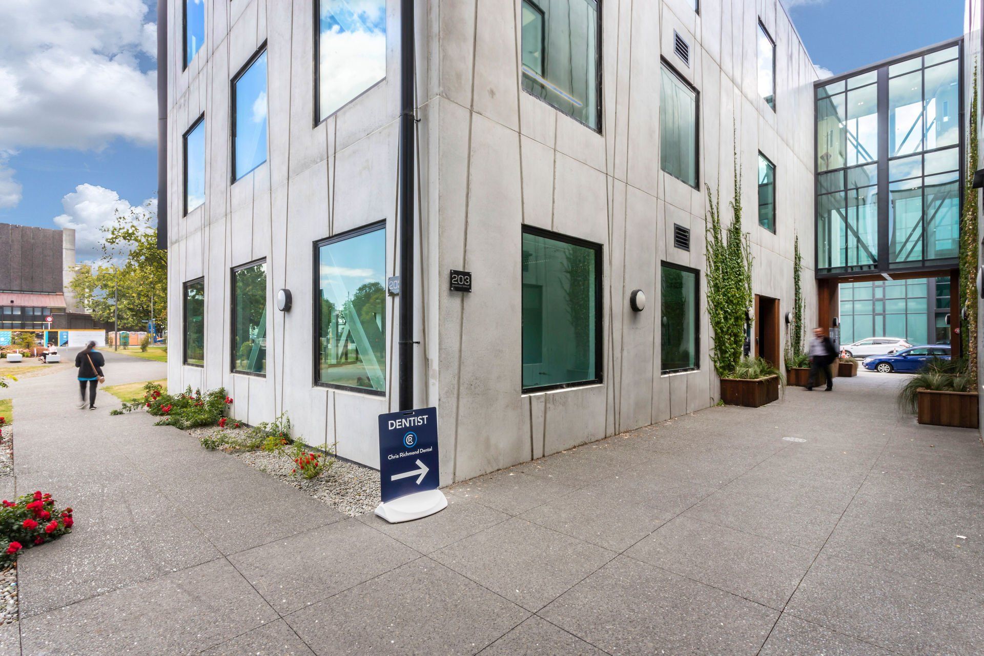 A building with a lot of windows and a sign that says ' t ' on it