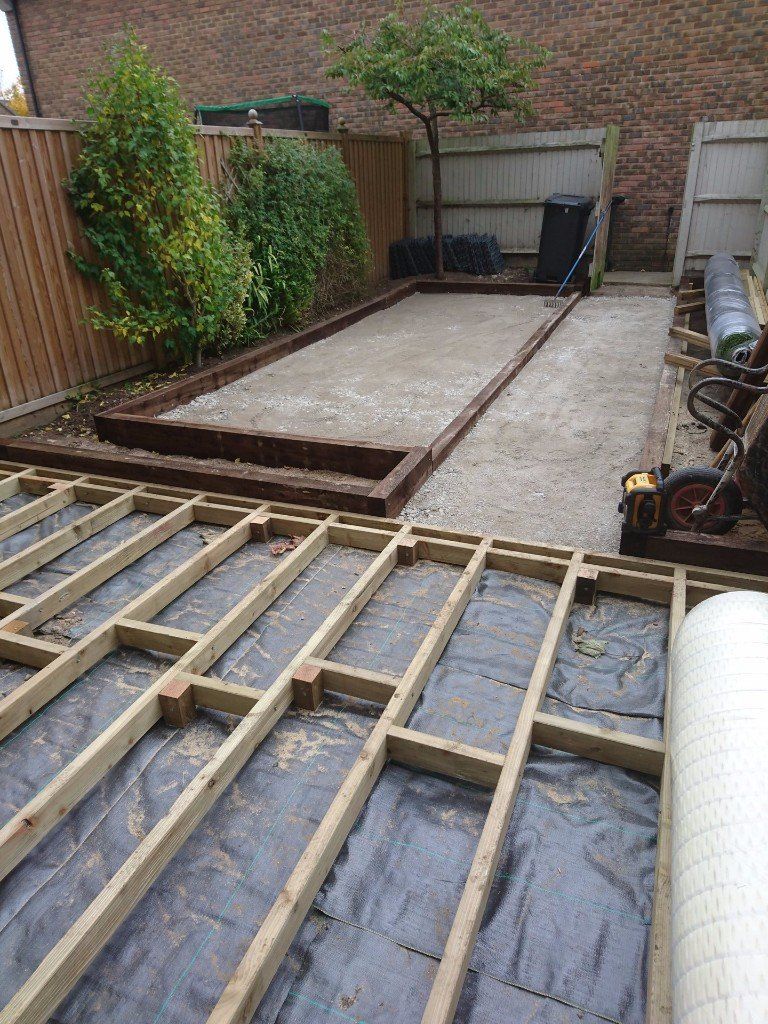 Back garden in process of having a decking installation