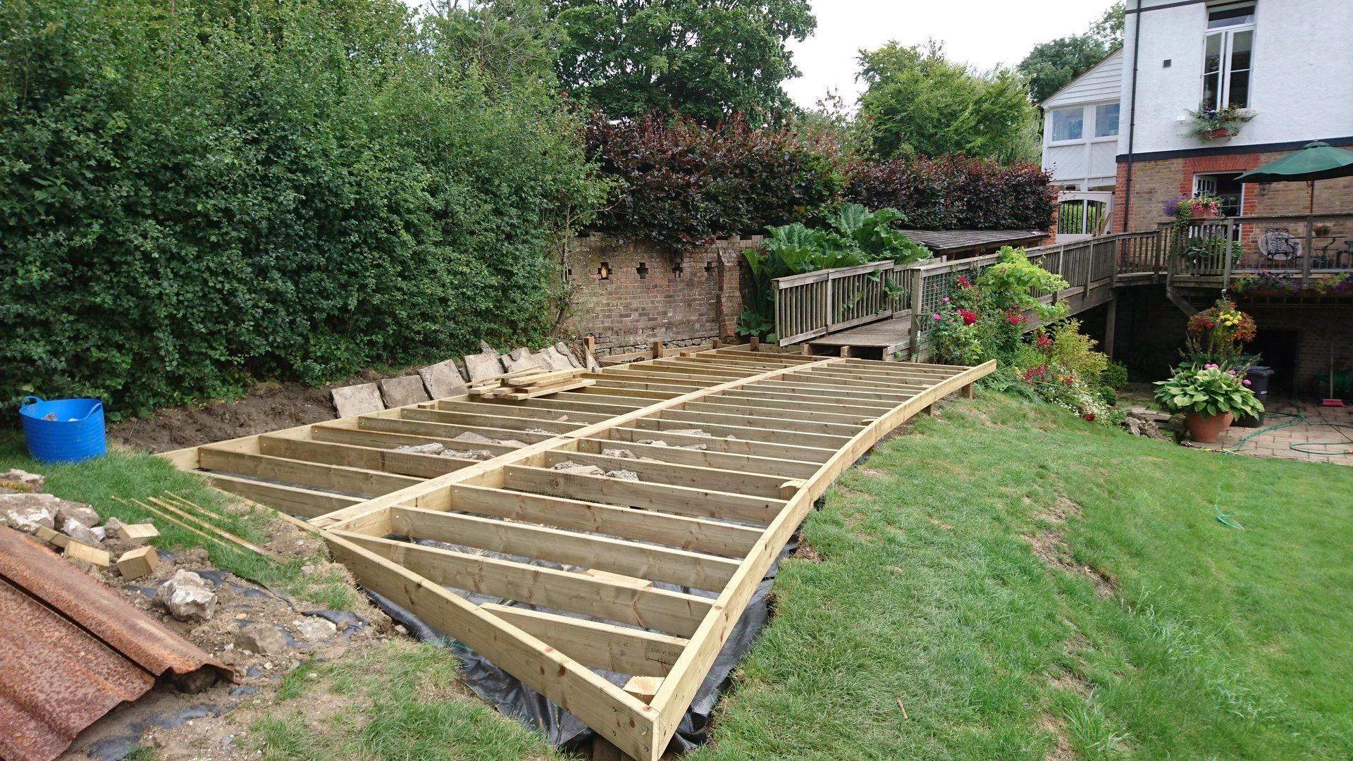 Garden in the process of having decking installed