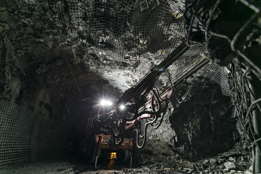 A Machine is Working in a Tunnel in a Mine — Secure Mine Solutions In Ryan, QLD