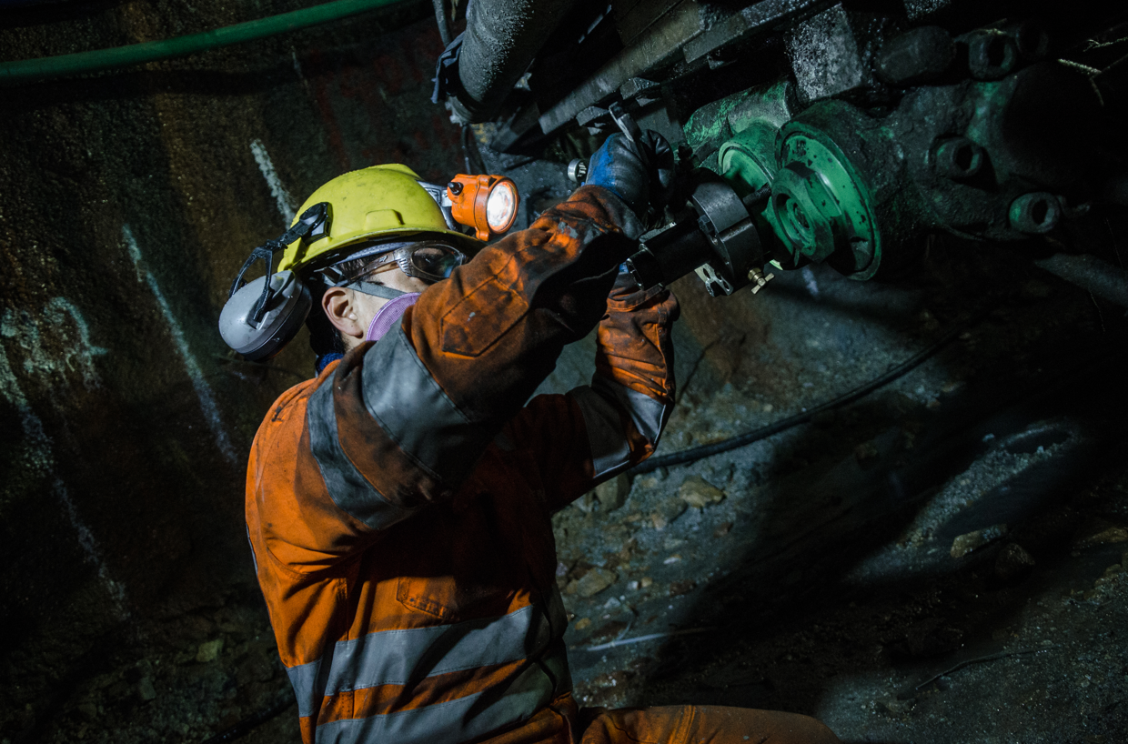A Man is Working in a Mining Underground  — Secure Mine Solutions In  Ryan, QLD
