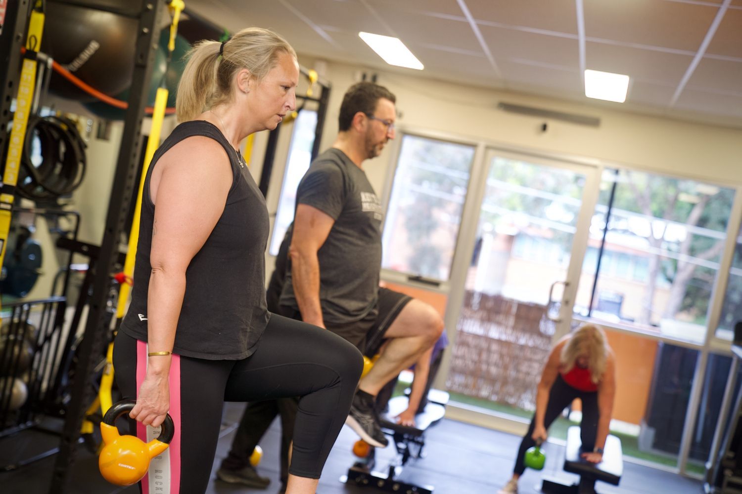 Studio Fitness Class clients completing boxing workout