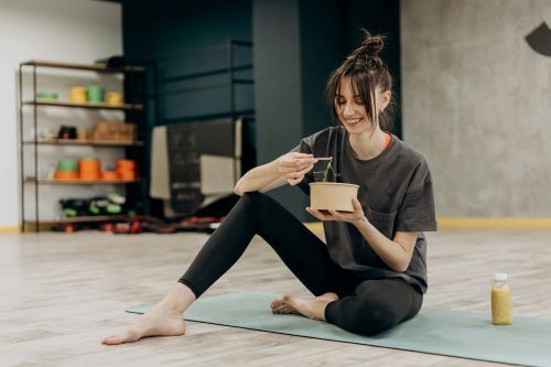Woman eating a healthy meal after a workout