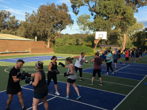 Group outdoor boxing class at Key to Life Health and Fitness