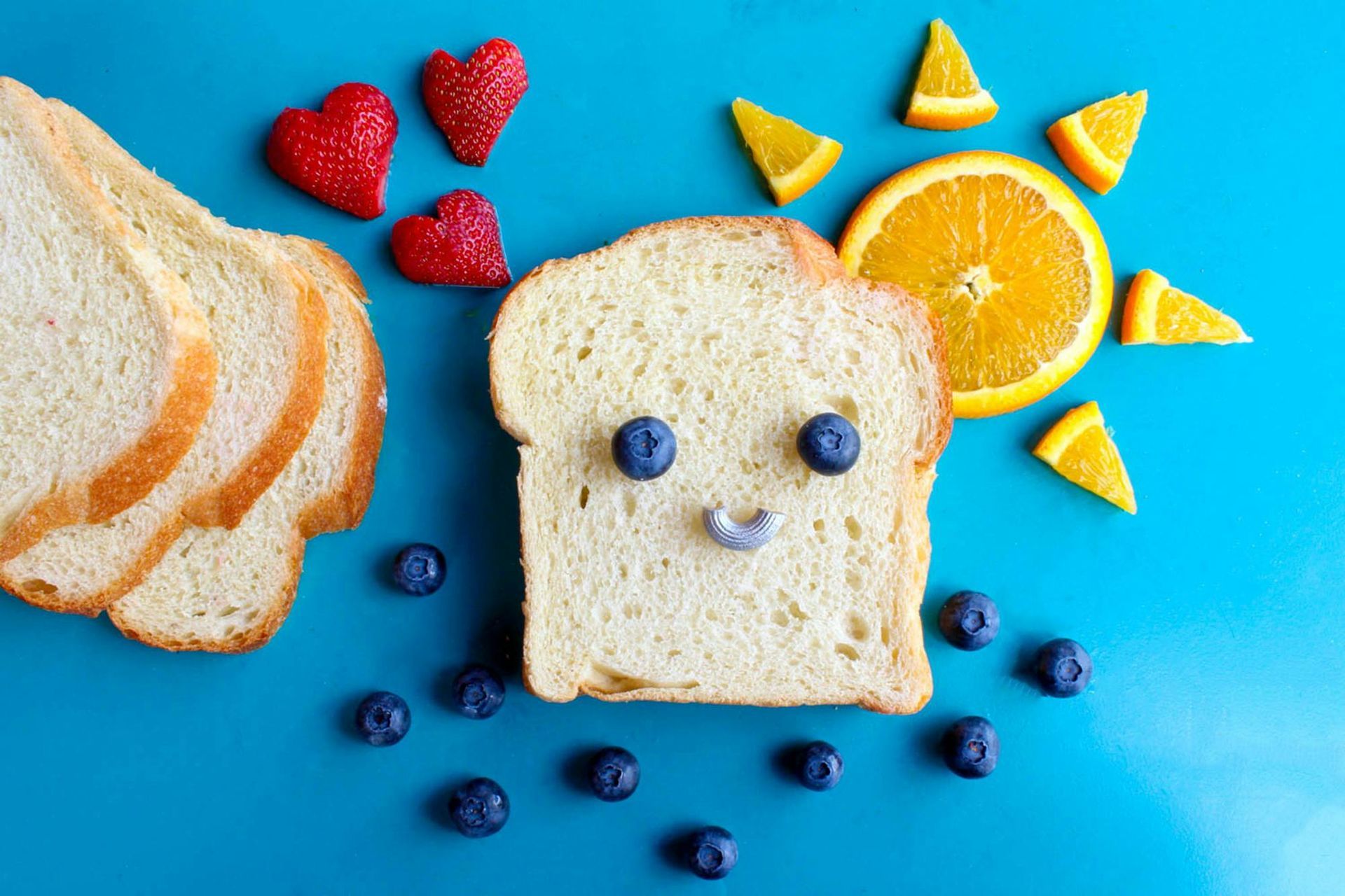 Slices of white bread arranged with fruit