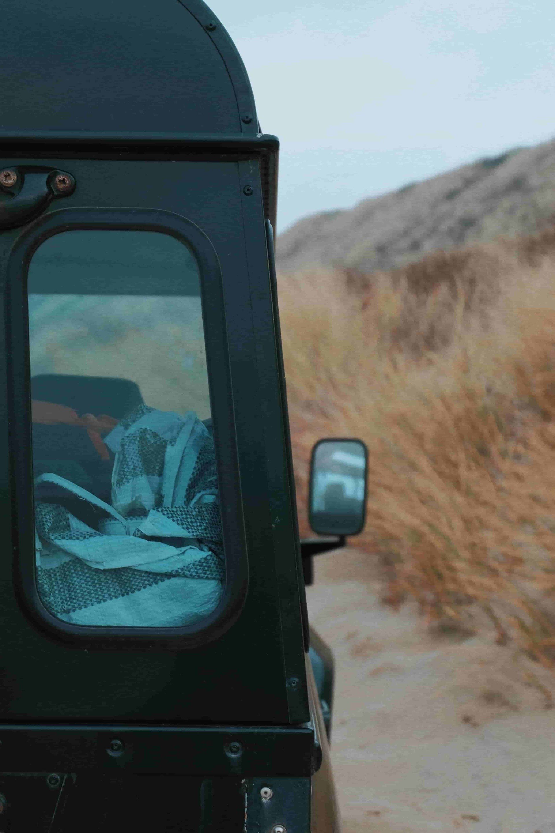 Land rover defender on a private beach.