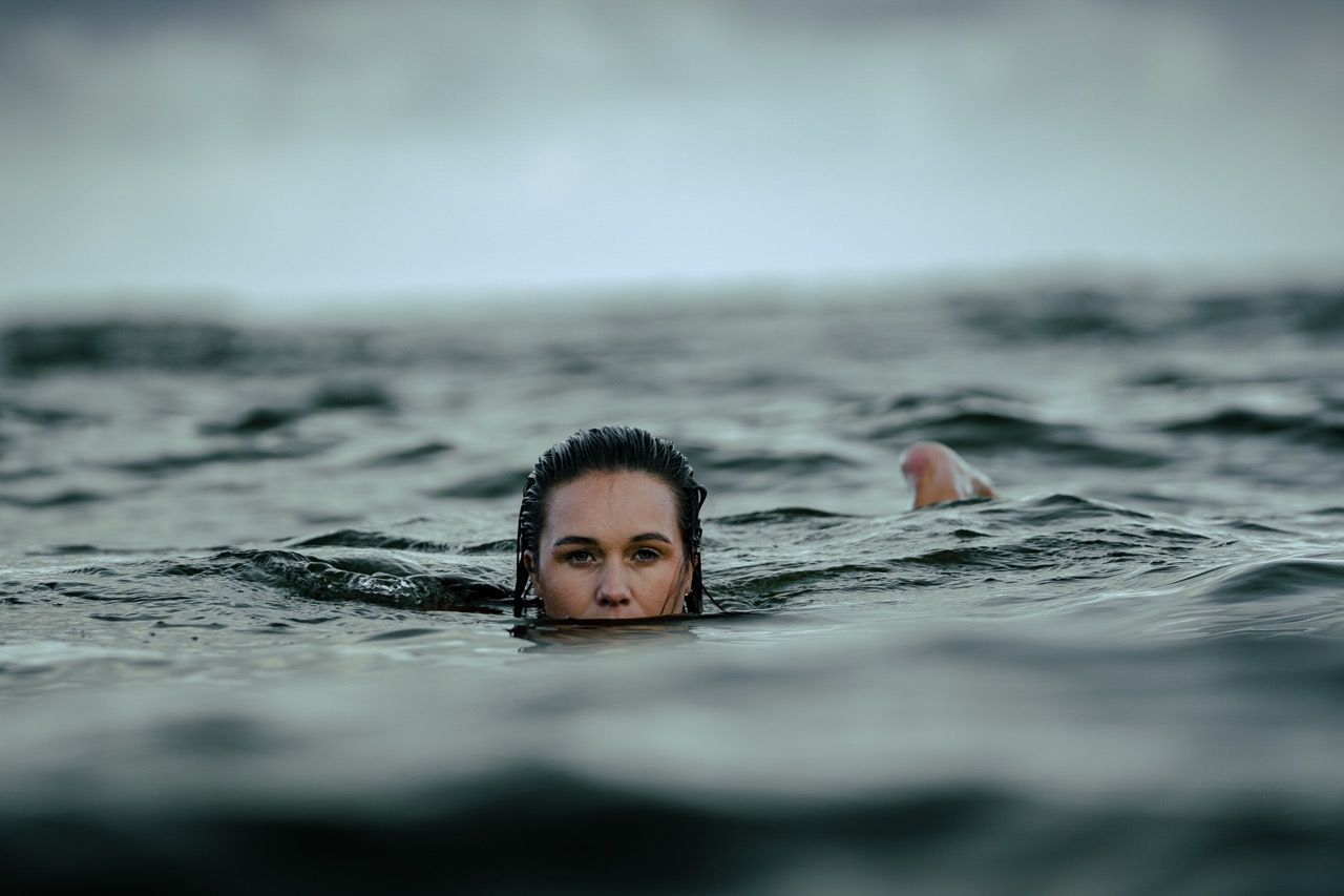 Wild swimming female in loch fyne water.