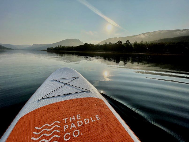 Paddle board on loch fyne at sunrise.