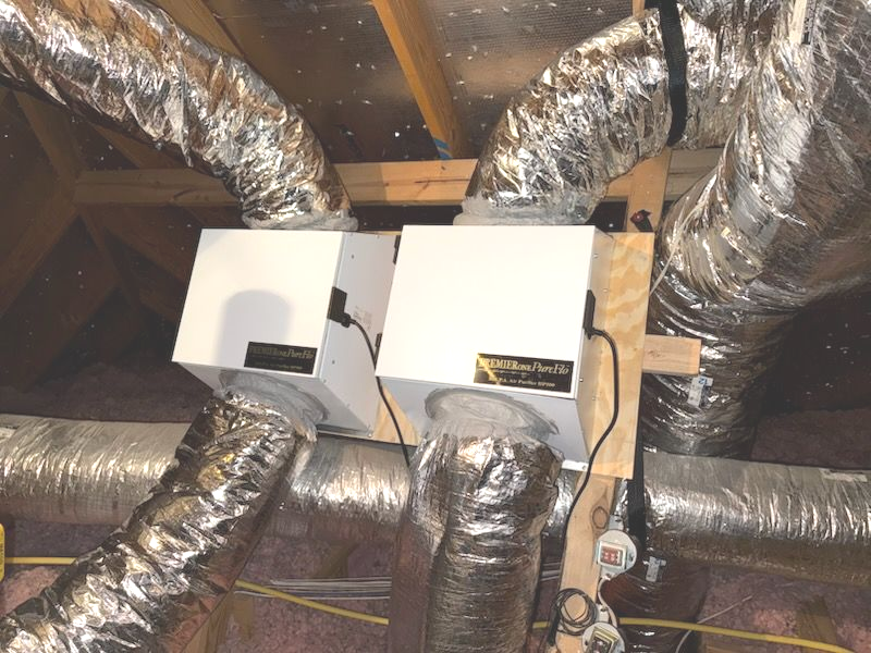 Motor covered in debris, with wires and a metal fan.