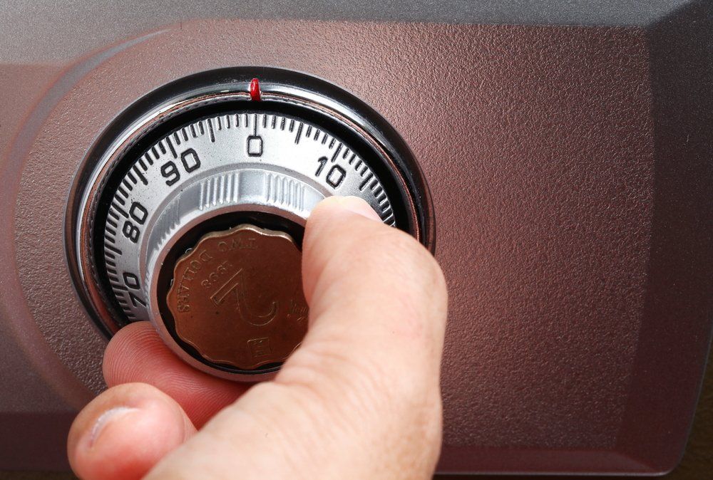 Man Entering a Combination into a Safe Dial Lock — CTS Locksmiths in Maroochydore, QLD