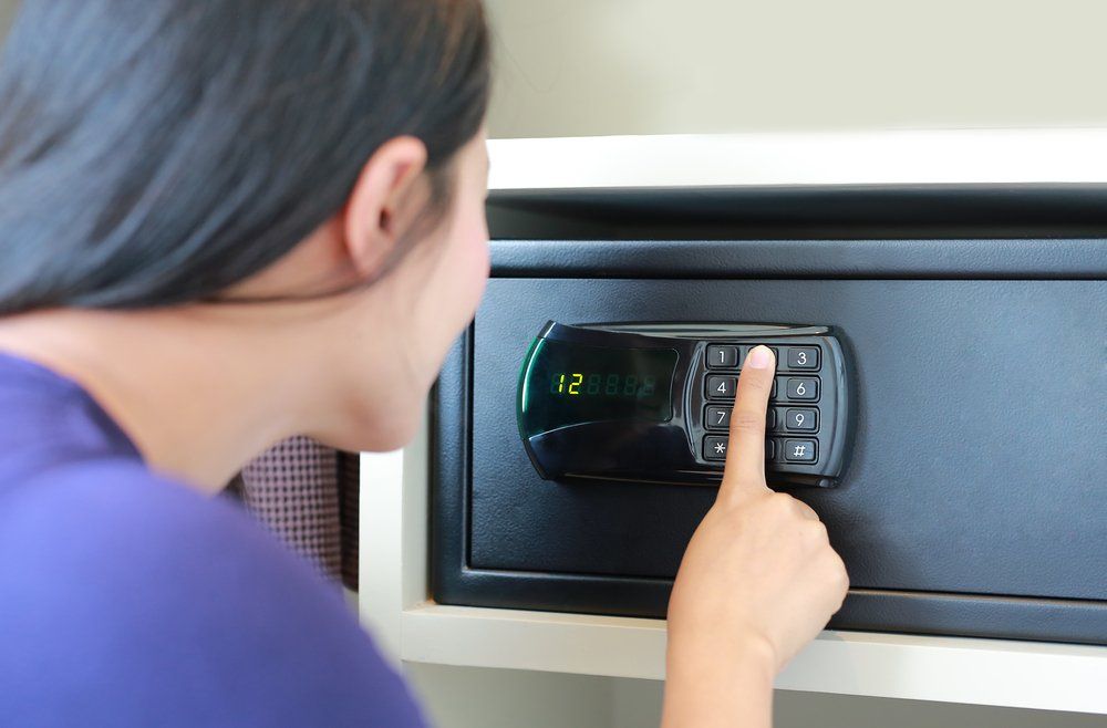 Woman Press Key on Safety Lock Pad Number — Locksmith in Beerwah, QLD