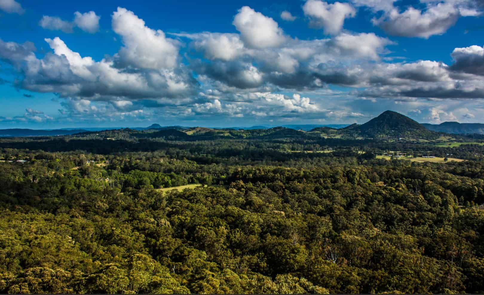 An Aerial View of a Lush Green Forest With Mountains — CTS Locksmiths in Nambour, QLD