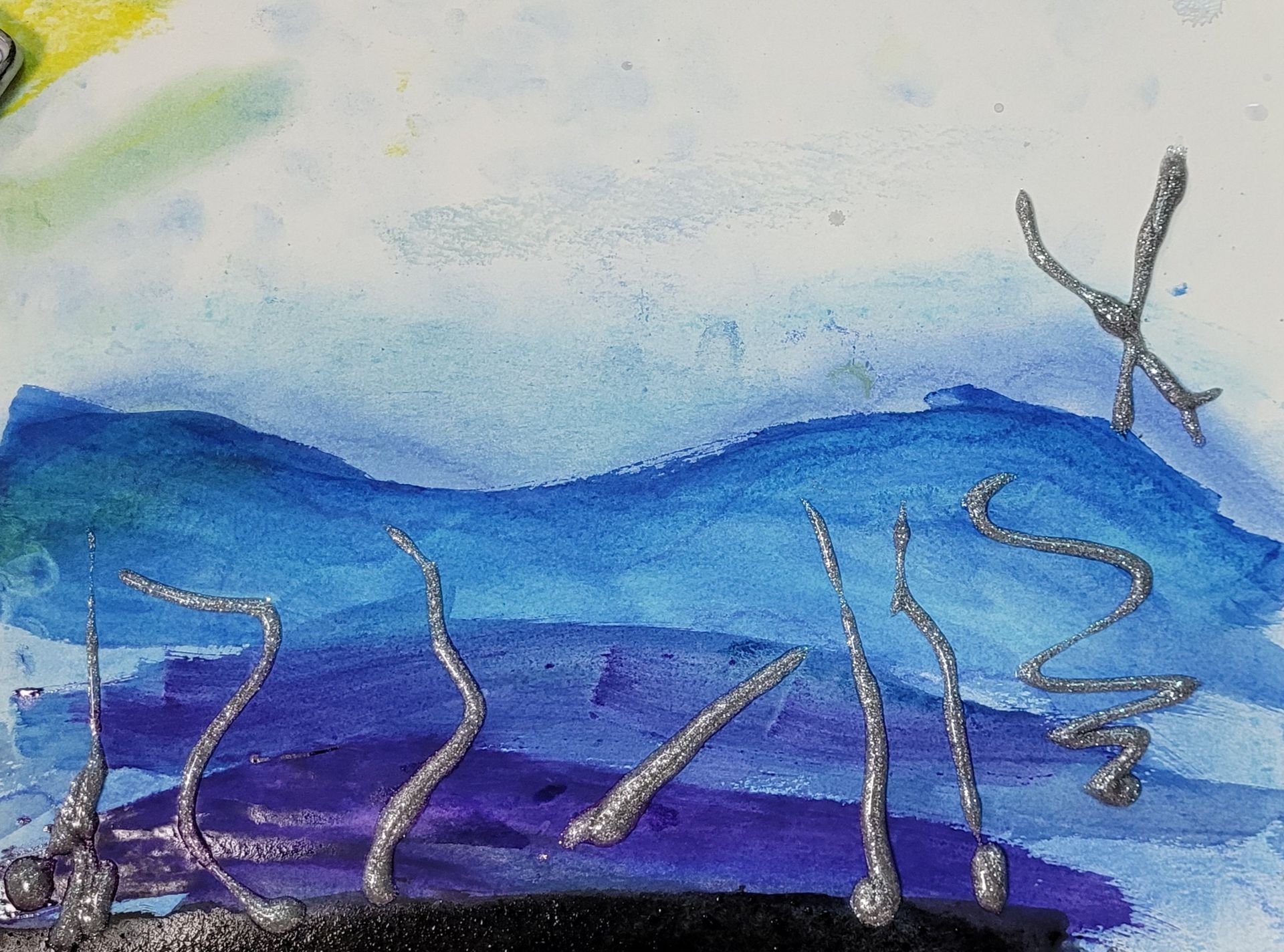 A close up of a painting of a blue and purple landscape