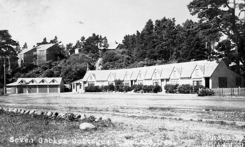 A black and white photo of a row of houses with the words seven inches written on the bottom