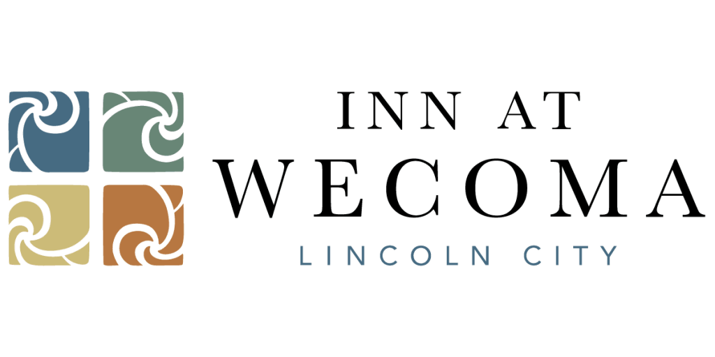 The logo for inn at wecoma lincoln city