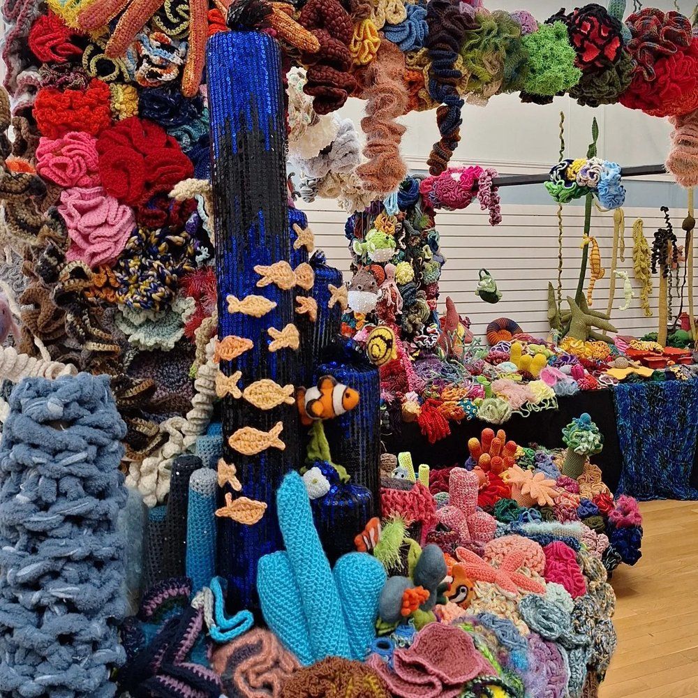 A sculpture of a coral reef made of yarn