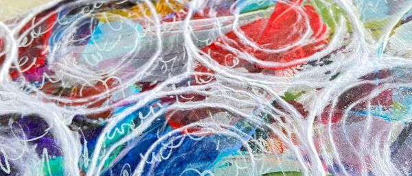 A close up of a colorful painting with white lines.