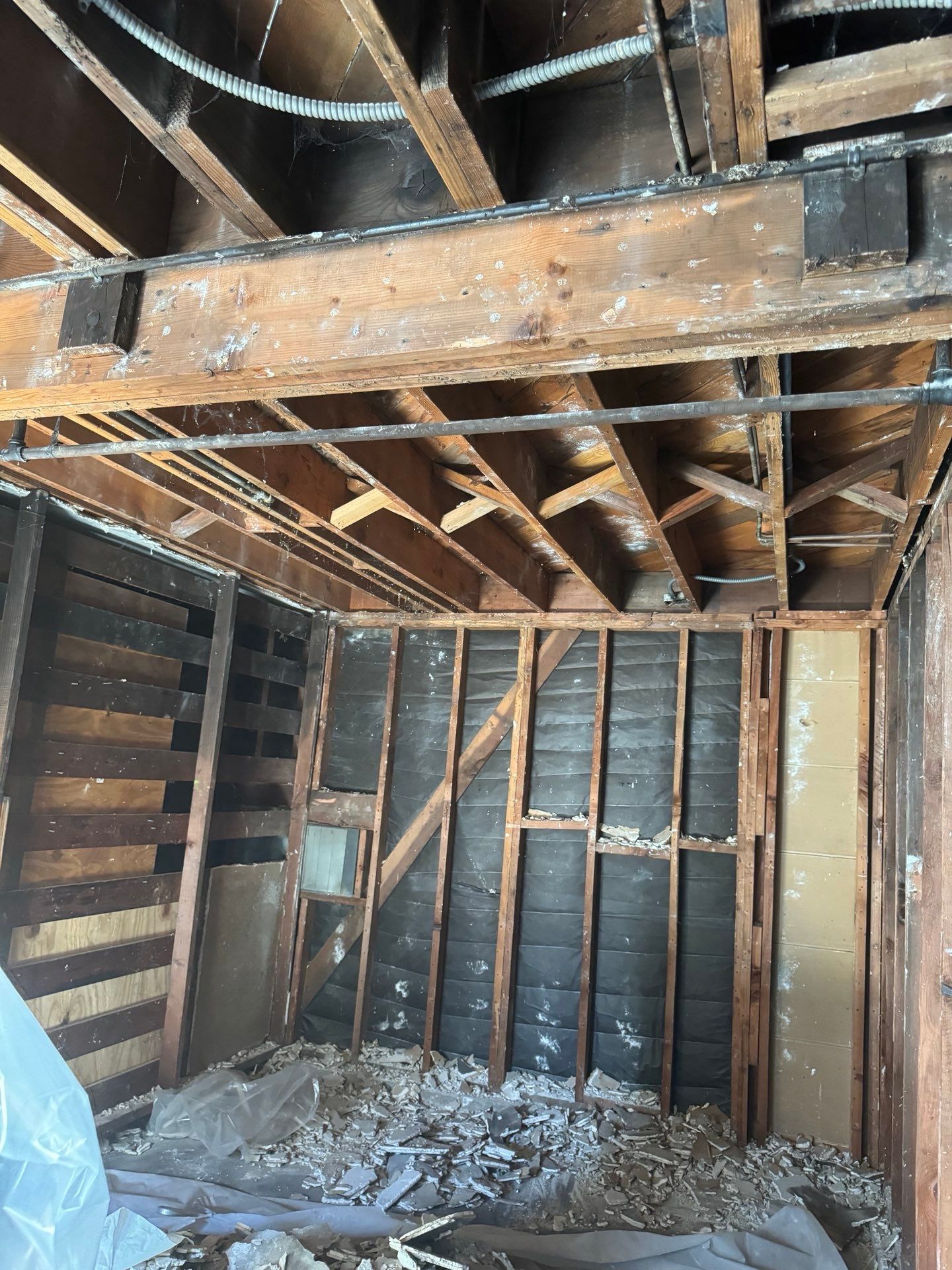 A room with a lot of wooden beams and a ceiling in Huntington Beach.