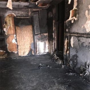 A room in a house that has been damaged by a fire in Garden Grove, CA.