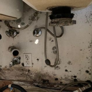 A bathroom sink with a lot of wires coming out of it in Fountain Valley, CA..