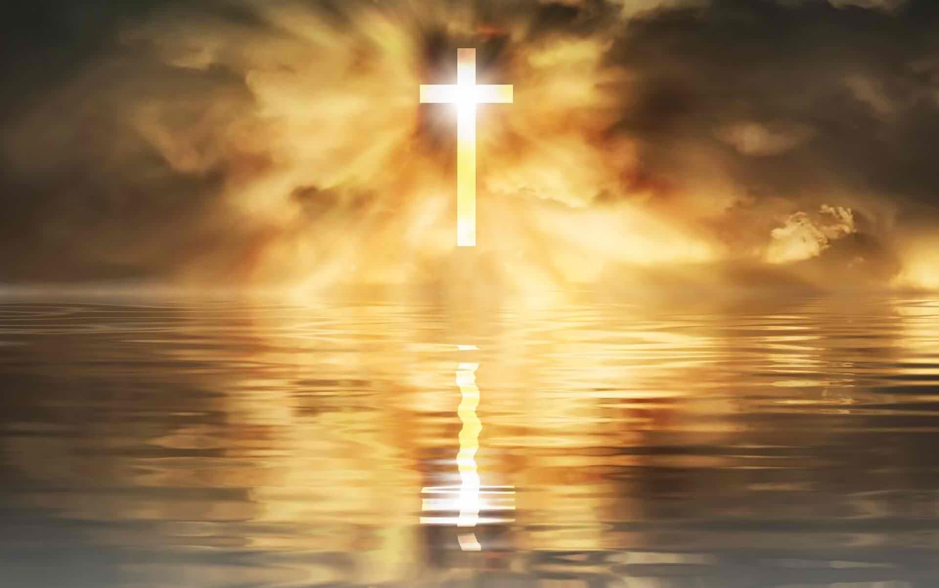 Cross of Jesus - luminous and reflected in water