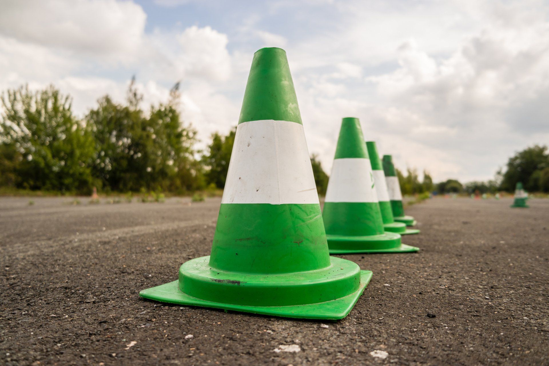 Green and white cones set up on a course for truck driving school
