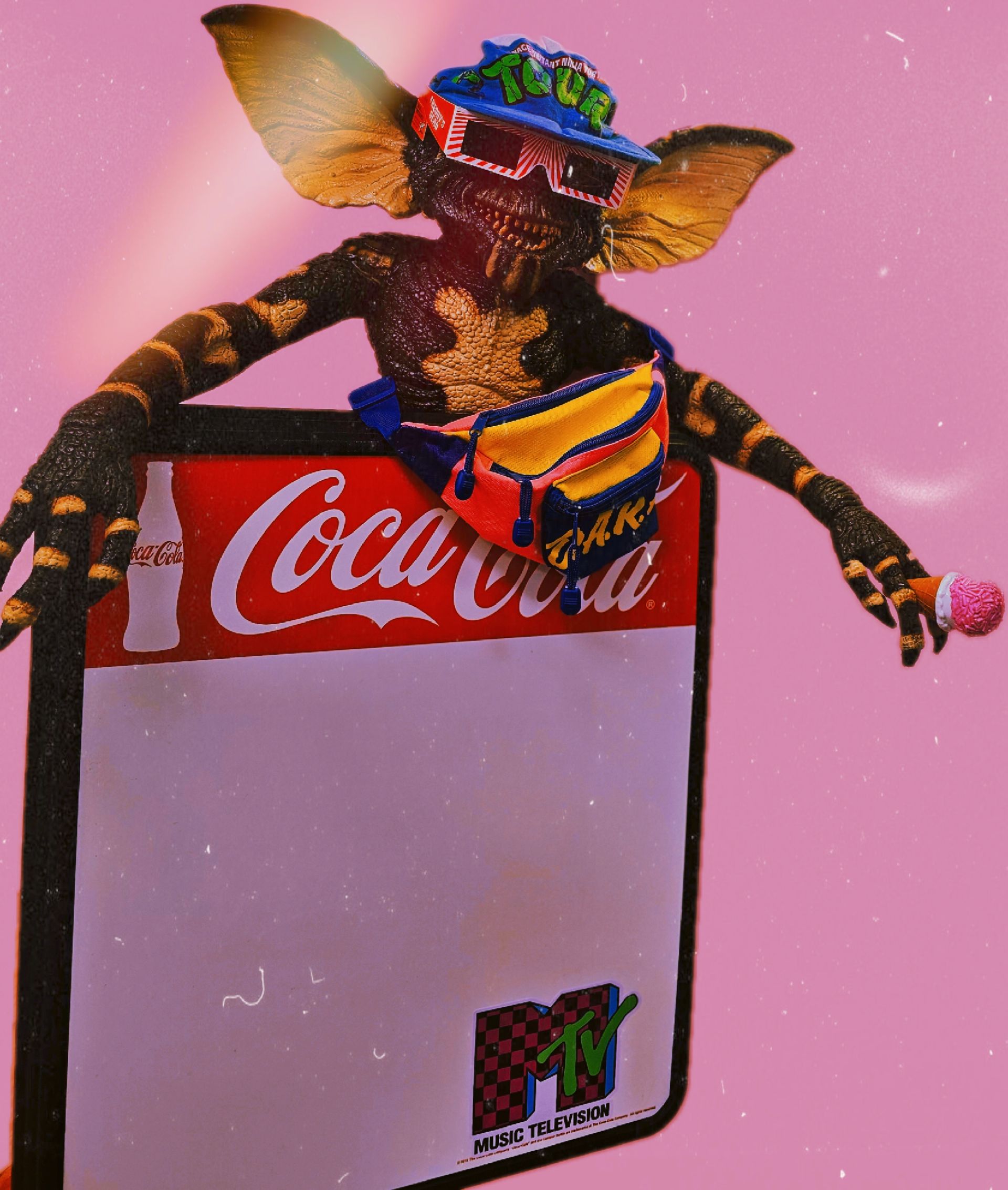 A gremlin is holding a sign that says coca cola