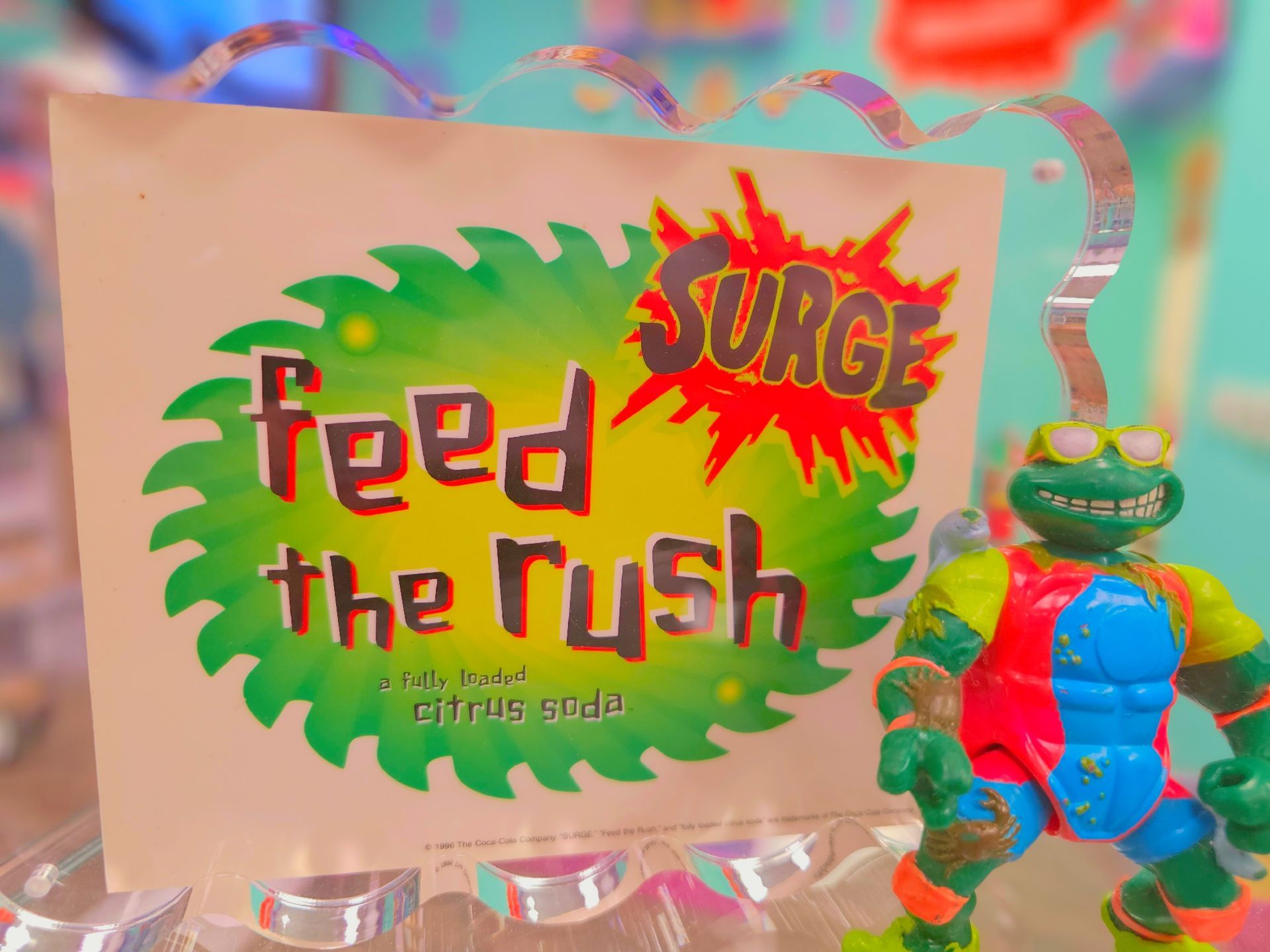 A toy with a sign that says feed the rush