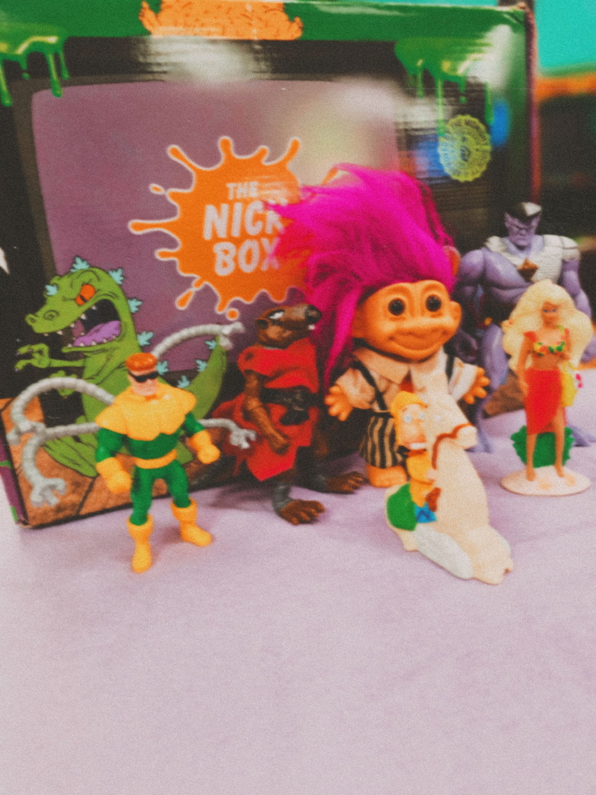 A group of nickelodeon toys are sitting on a table