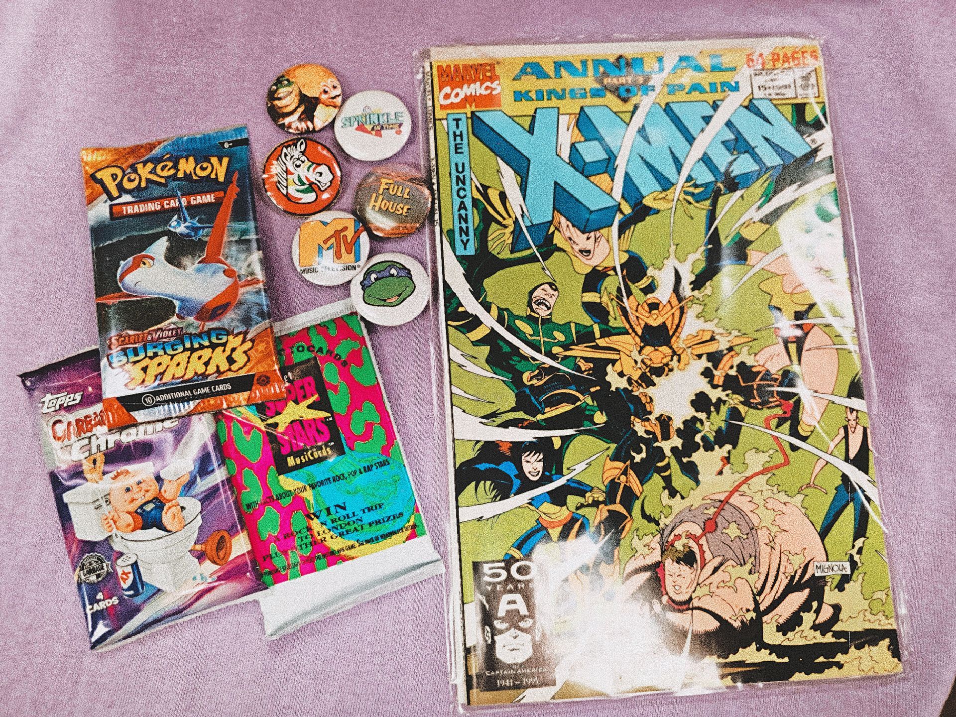 A x-men comic book is sitting on top of a table next to a bag of cereal.