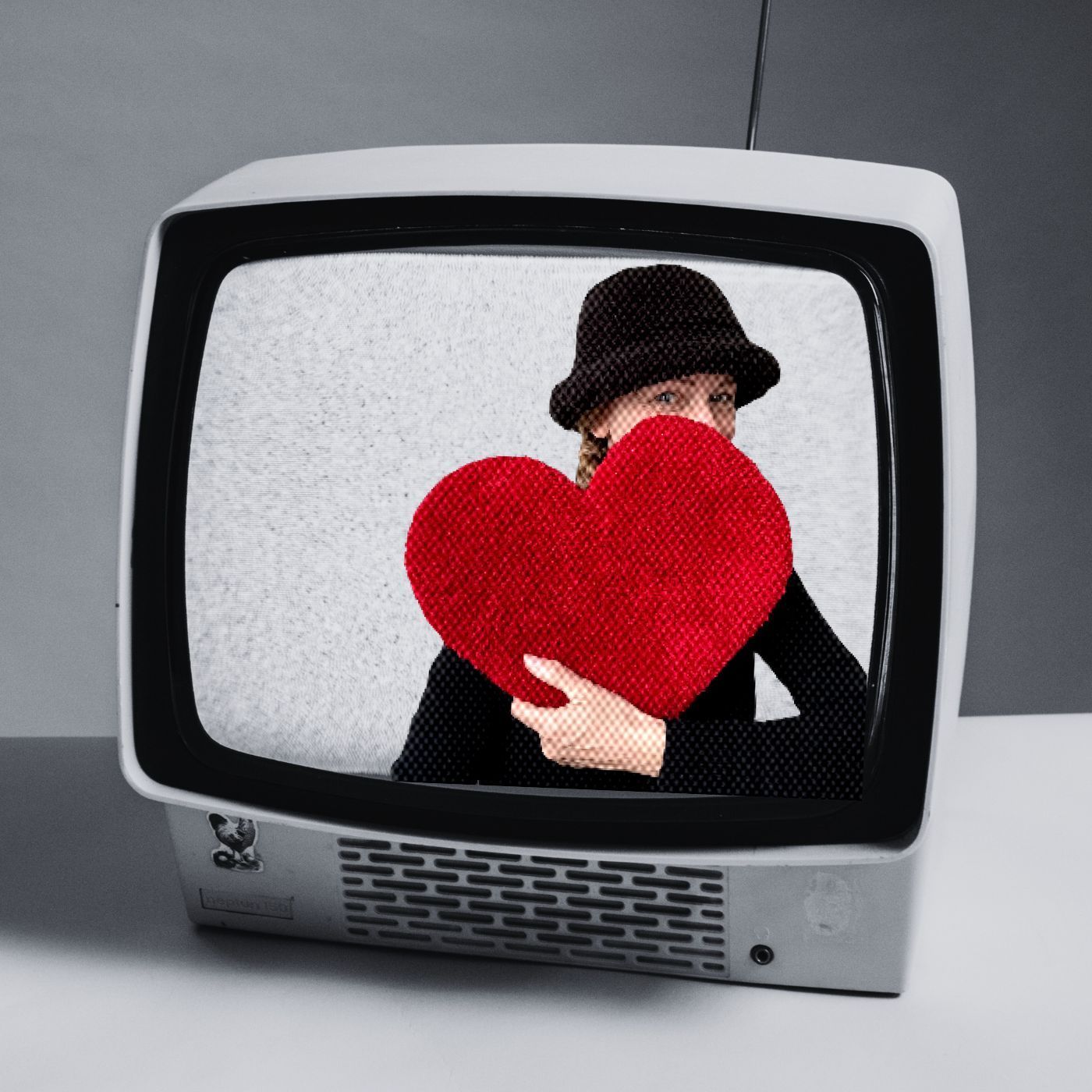 Mir holding a red heart, previewing her blog about love’s power.