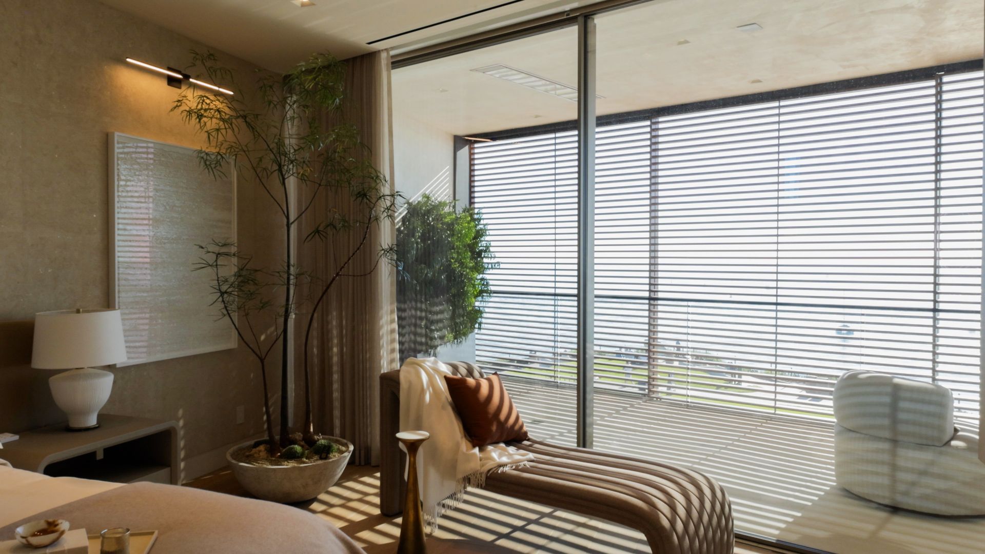 Modern white house exterior at dusk with a swimming pool, glowing landscape lighting, and patio seating on synthetic turf.