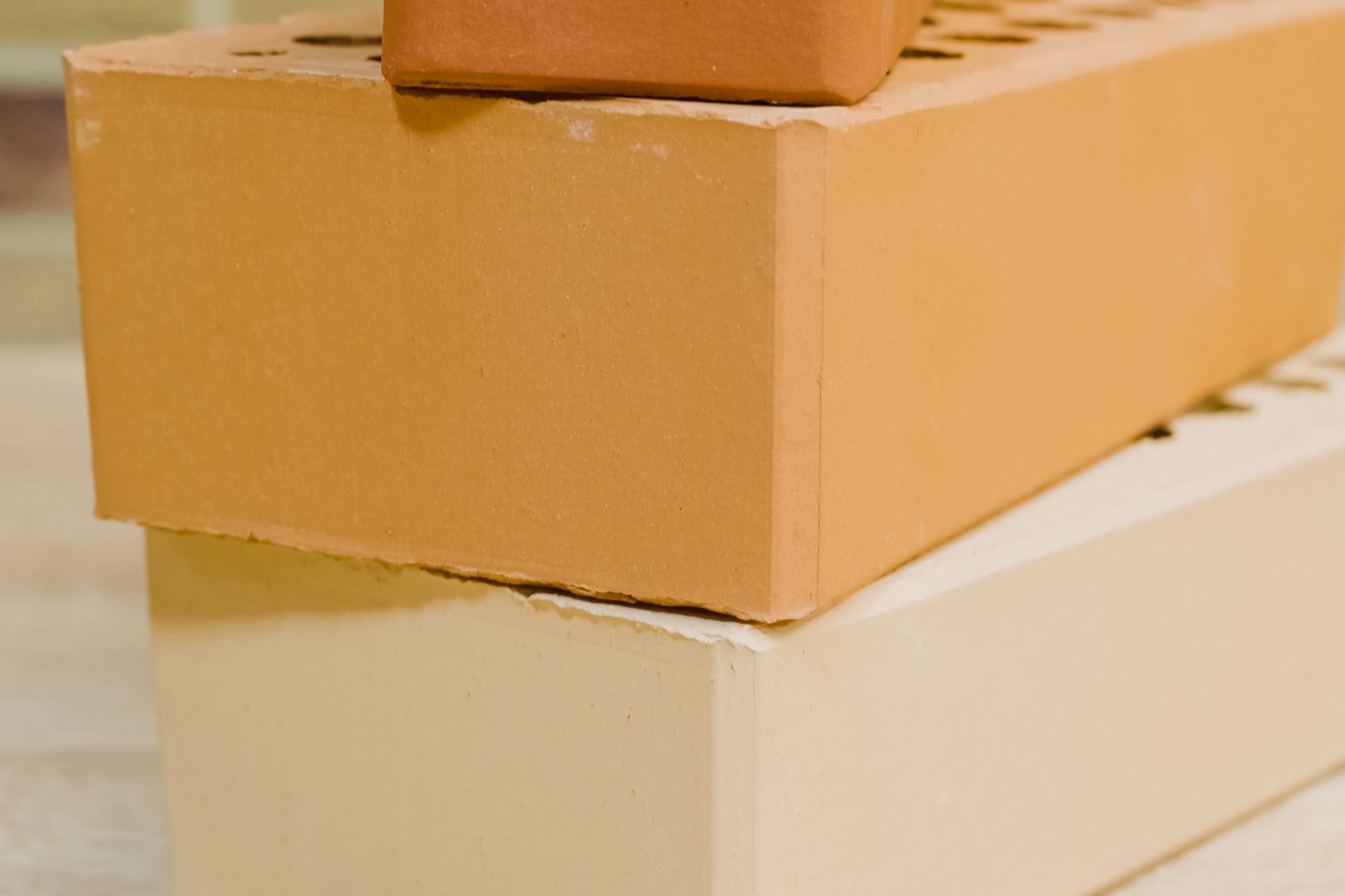 Stacked cardboard boxes in tan and cream colors